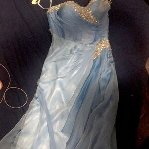 The colour is ocean blue, made by romantic bridals., pretty dress. Leg slit too